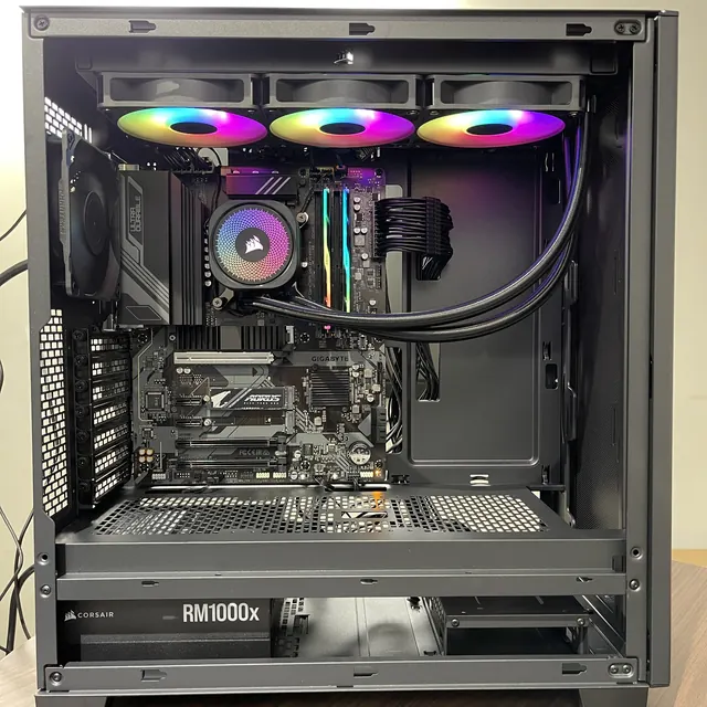 Open custom PC build with a 360 mm AIO liquid cooler and 1000 W power supply